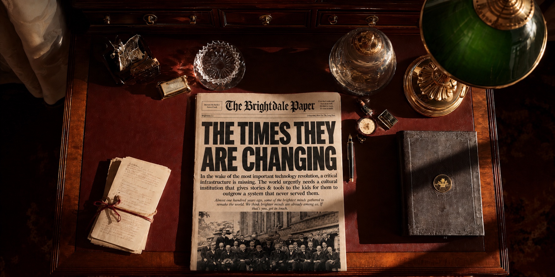 The Brightdale Paper, Issue Nº 1, 'The times they are changing.', resting on an antique mahogany writing desk with a green banker's lamp, brass inkwell, leather notebook, pocket watch, and a bundle of handwritten manuscripts.